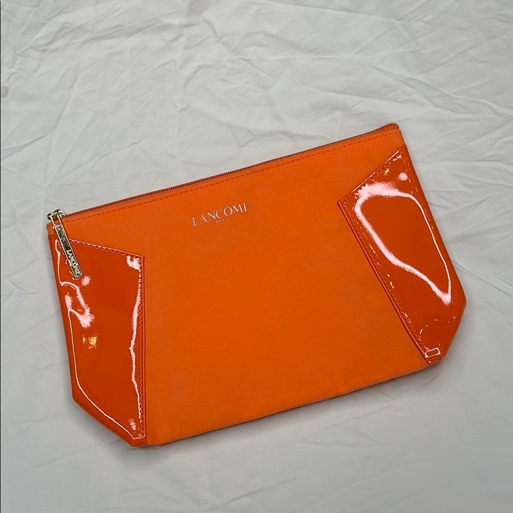 BEAND NEW! Vibrant Orange Cosmetic Bag with Glossy Finish and Zipper Closure.